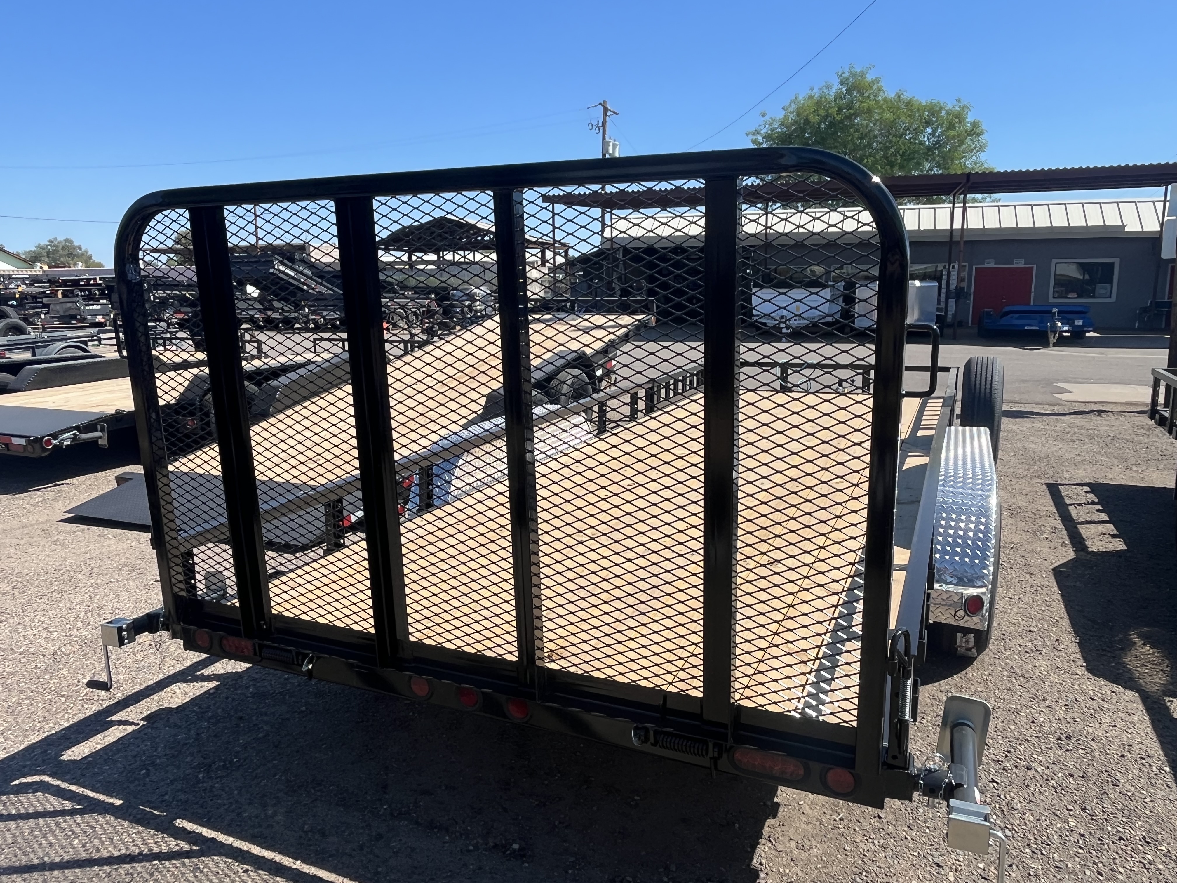 PJ Trailers 20x83 Tandem Axle, 10K GVWR, Channel Utility w/ 4' Fold Up Gate, ATV Ramps